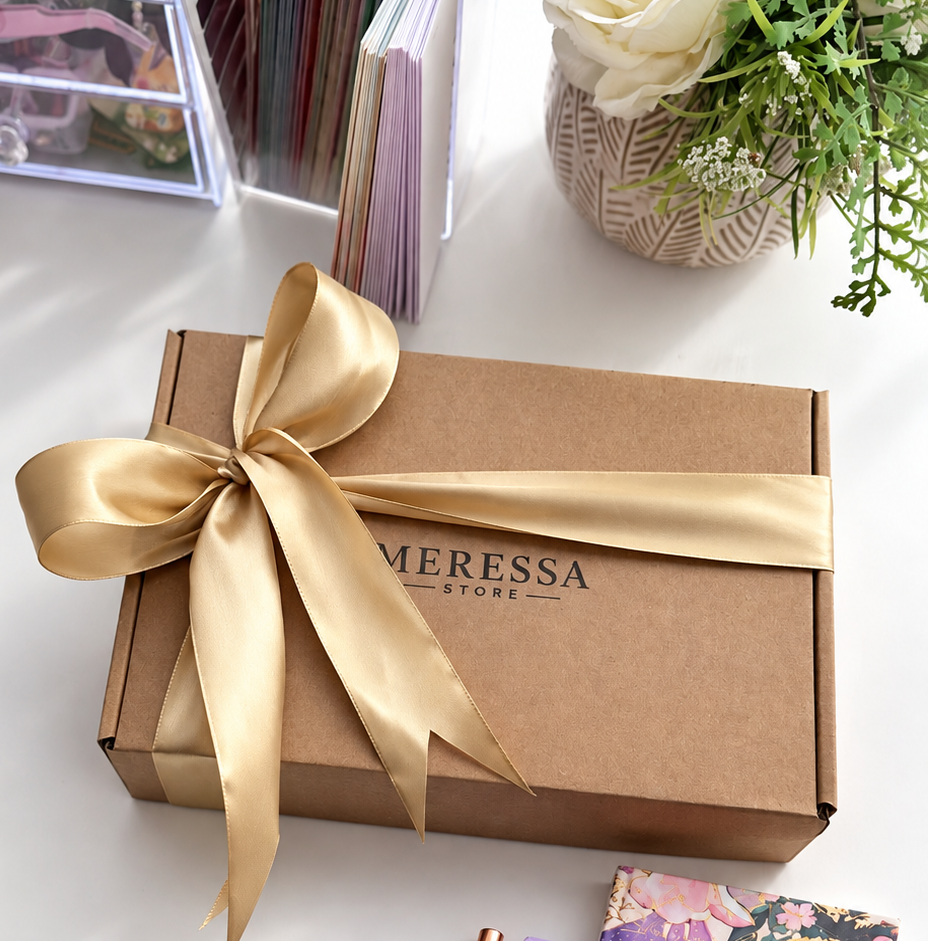 Gift-wrapped rhinestone craft kit in a box with gold ribbon
