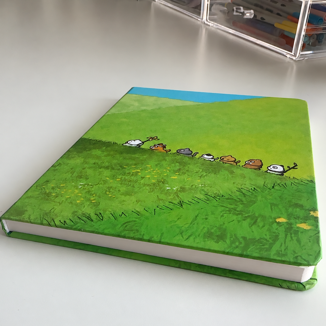 Hardcover lined notebook with cute little animals and a bright green design